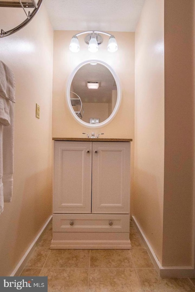 bathroom with vanity and tile patterned floors