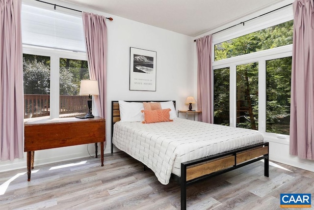 bedroom with wood-type flooring