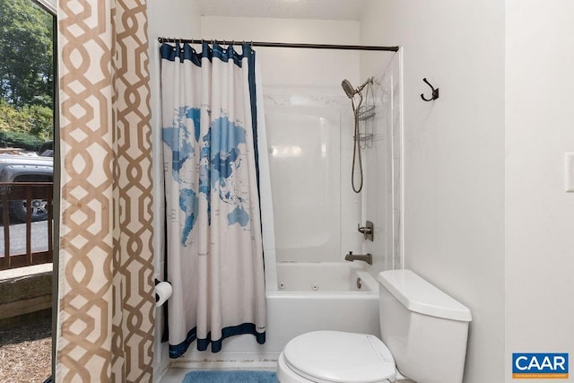 bathroom featuring toilet and shower / tub combo