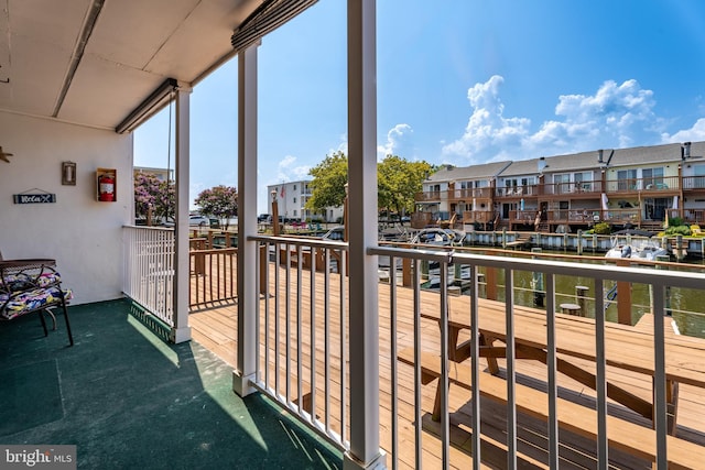 balcony featuring a water view