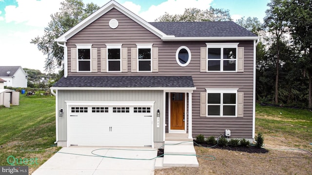 view of front of house featuring a garage and a front yard