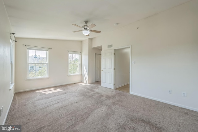 unfurnished bedroom featuring carpet floors, visible vents, and baseboards