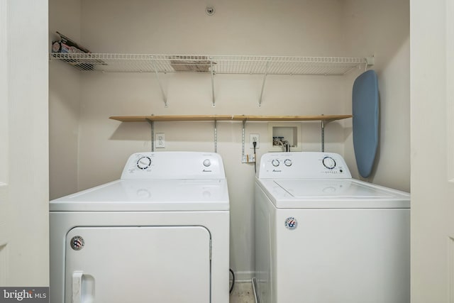 washroom with washer and clothes dryer