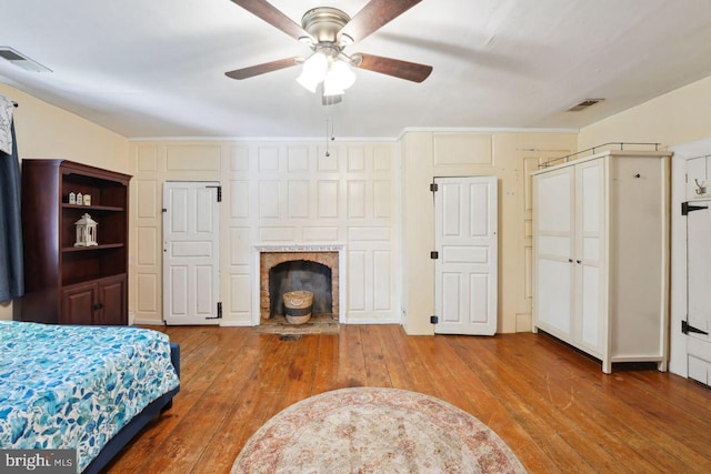 bedroom featuring wood-type flooring and ceiling fan