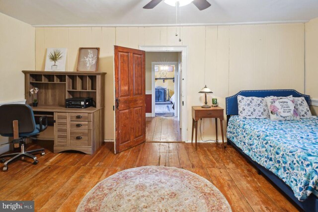 bedroom featuring wood-type flooring and ceiling fan