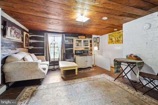 sitting room featuring wood ceiling and wood-type flooring