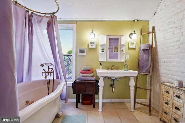 bathroom with vaulted ceiling, brick wall, tile patterned floors, and shower / bathtub combination with curtain