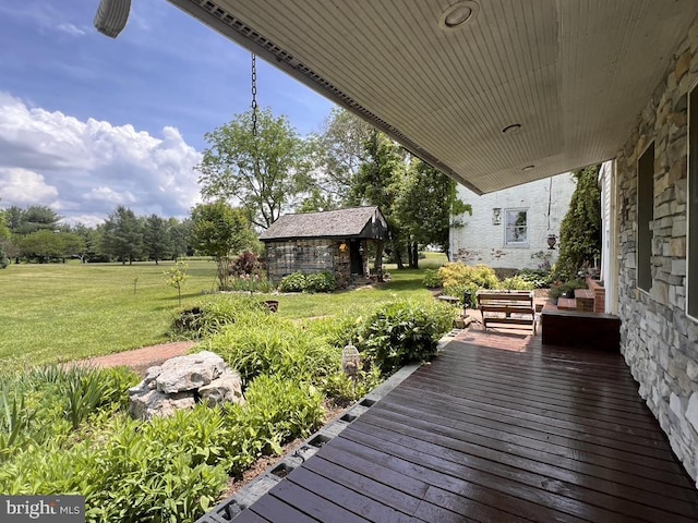 wooden deck with a yard