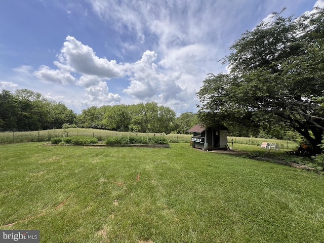 view of yard with a rural view