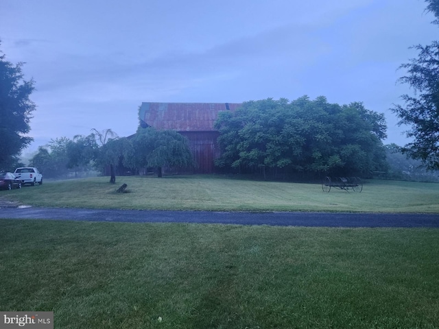 surrounding community featuring a yard