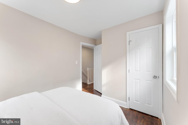 bedroom featuring dark hardwood / wood-style flooring