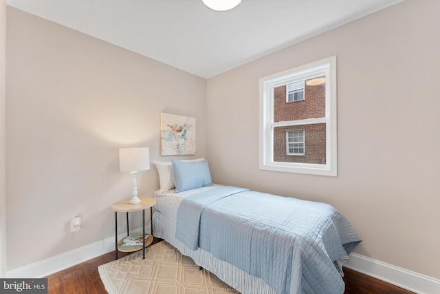 bedroom with hardwood / wood-style flooring