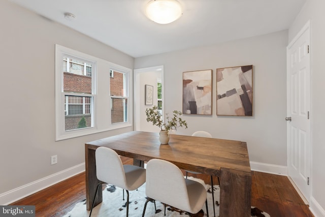 dining room with dark wood-type flooring