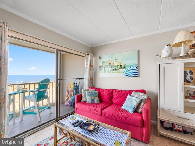 living area with a water view, light tile patterned floors, and crown molding