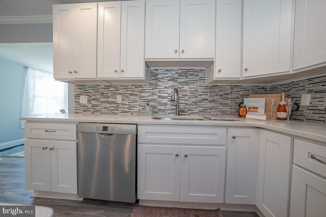 kitchen featuring white cabinetry, tasteful backsplash, sink, dark hardwood / wood-style floors, and stainless steel dishwasher