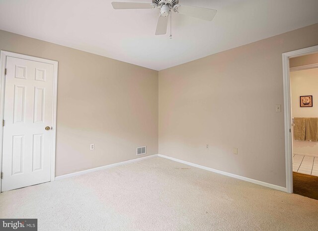 unfurnished bedroom with ceiling fan and carpet floors