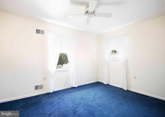 carpeted empty room with ceiling fan