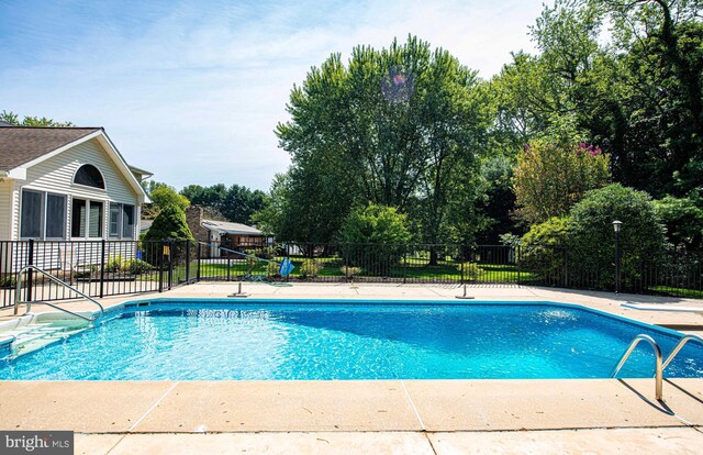 view of pool featuring a patio area