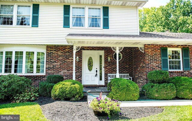 entrance to property with a porch