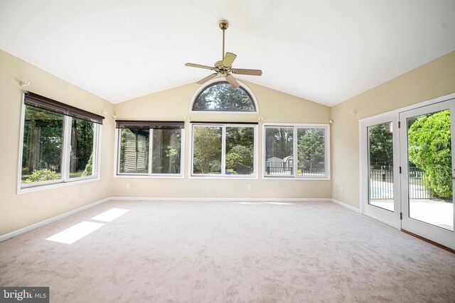 unfurnished sunroom with lofted ceiling and ceiling fan