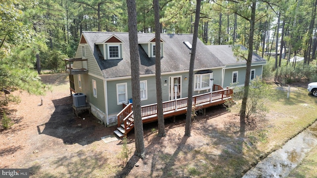 817 Seabreeze Rd, Cambridge, MD 21613 - view of front facade with a shingled roof, a deck, and central AC