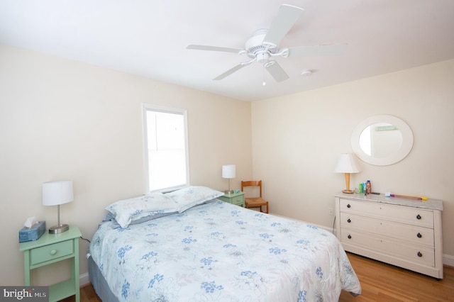 817 Seabreeze Rd, Cambridge, MD 21613 - bedroom featuring baseboards, wood finished floors, and a ceiling fan