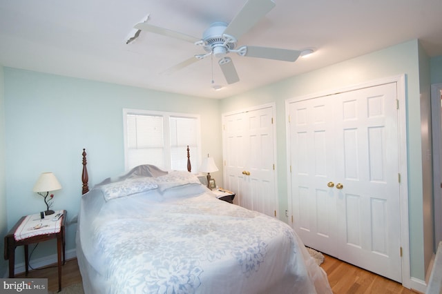817 Seabreeze Rd, Cambridge, MD 21613 - bedroom featuring baseboards, multiple closets, ceiling fan, and light wood finished floors