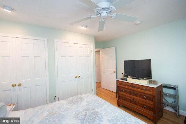 817 Seabreeze Rd, Cambridge, MD 21613 - bedroom with baseboards, ceiling fan, wood finished floors, and two closets