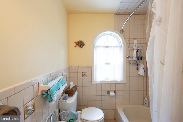 817 Seabreeze Rd, Cambridge, MD 21613 - full bathroom with tile walls, a wainscoted wall, toilet, and shower / bath combination with curtain