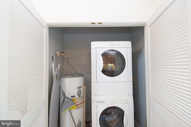 817 Seabreeze Rd, Cambridge, MD 21613 - laundry area featuring stacked washer / dryer, electric water heater, and laundry area