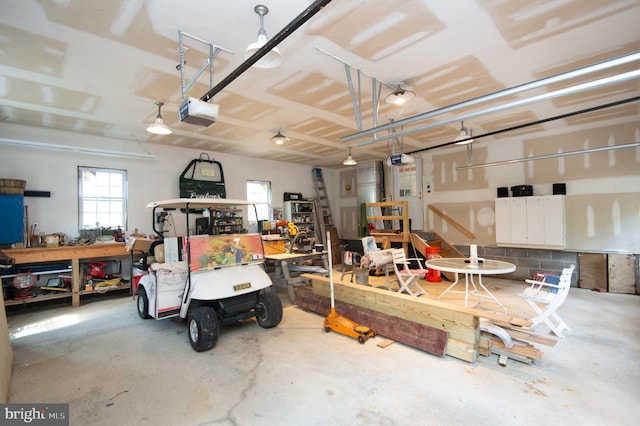 817 Seabreeze Rd, Cambridge, MD 21613 - garage with a workshop area and a garage door opener