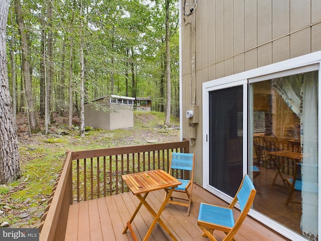 deck featuring a shed