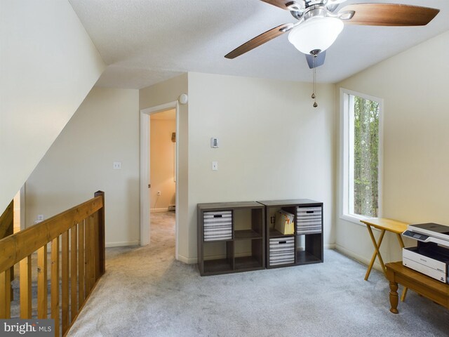 home office featuring light colored carpet and ceiling fan