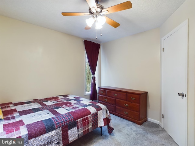 bedroom featuring ceiling fan and light colored carpet