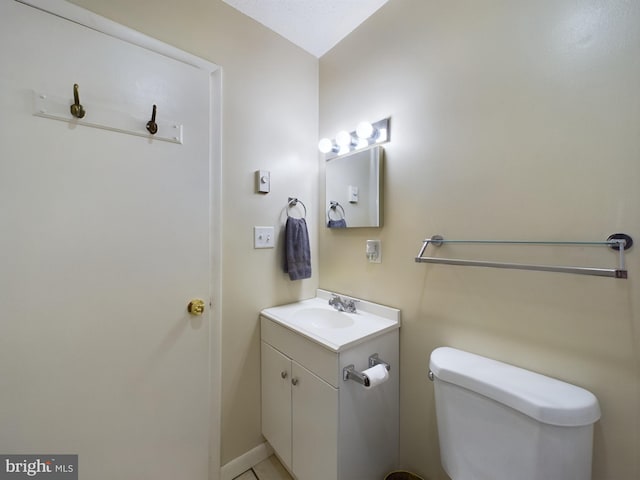 bathroom featuring toilet and vanity