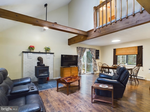 living room featuring a wood stove, high vaulted ceiling, a baseboard radiator, and dark wood-type flooring