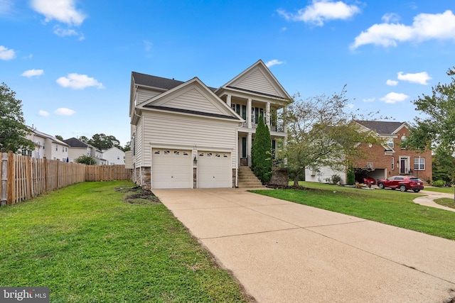 view of front of home featuring a garage and a front yard