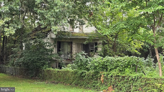 view of property hidden behind natural elements