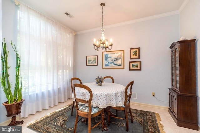 dining area with a chandelier and crown molding