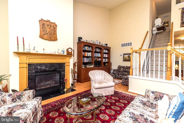 living room with hardwood / wood-style flooring and a fireplace