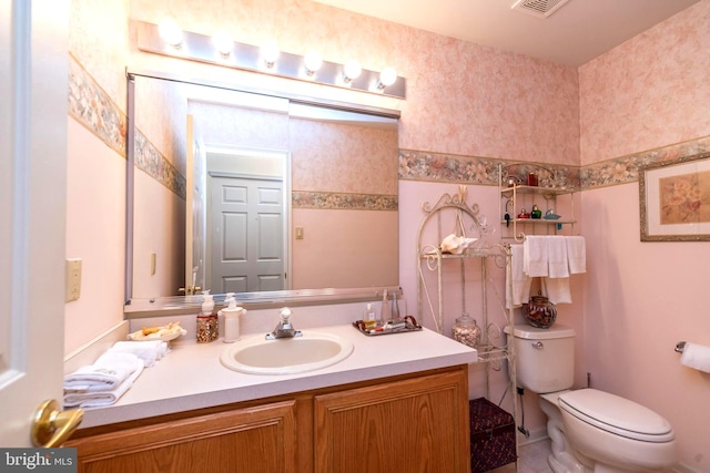 bathroom with vanity and toilet