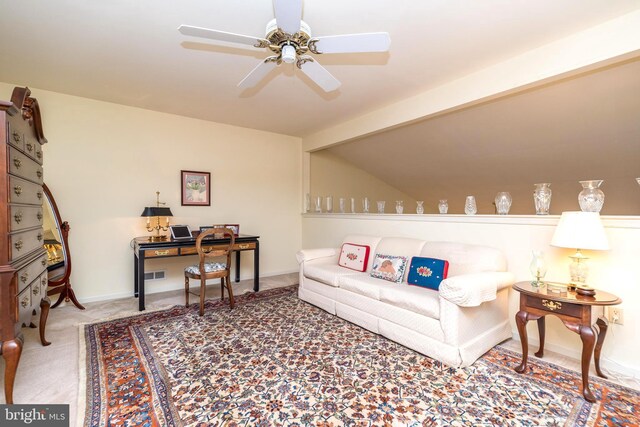 carpeted living room with beam ceiling and ceiling fan