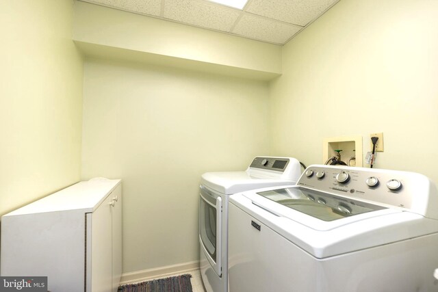 laundry area with independent washer and dryer