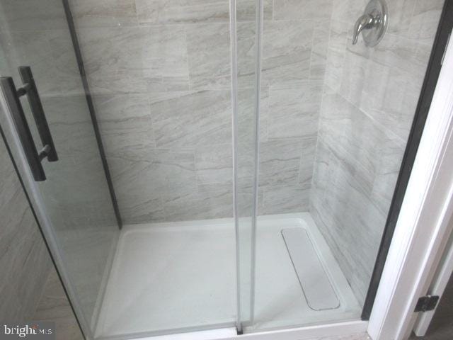 bathroom featuring an enclosed shower