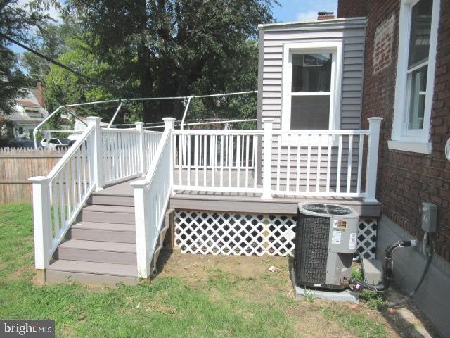 wooden deck with central AC unit