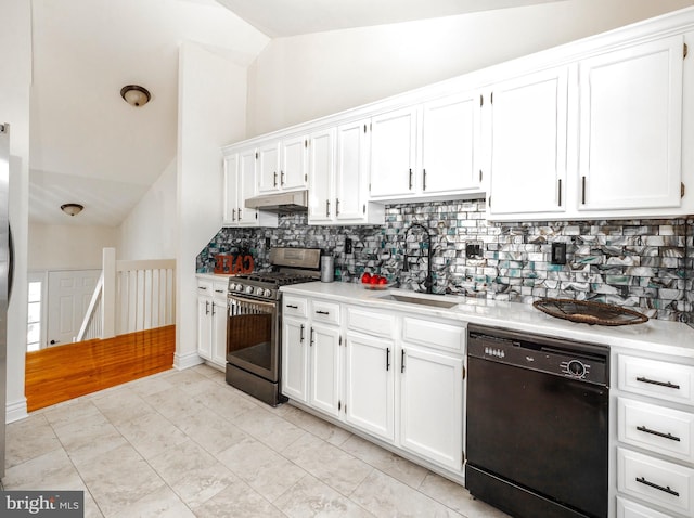 kitchen with dishwasher, stainless steel gas stove, sink, and vaulted ceiling