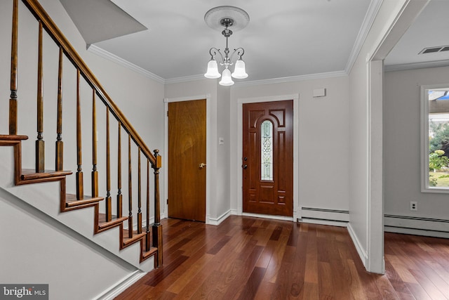 foyer with an inviting chandelier, ornamental molding, baseboard heating, and dark wood-type flooring