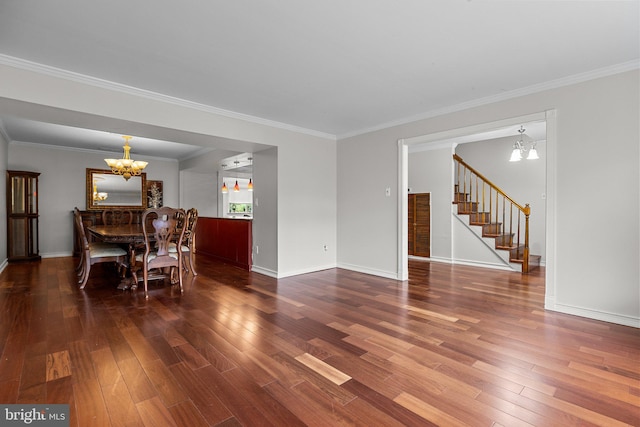 dining area with a notable chandelier, ornamental molding, and dark hardwood / wood-style flooring