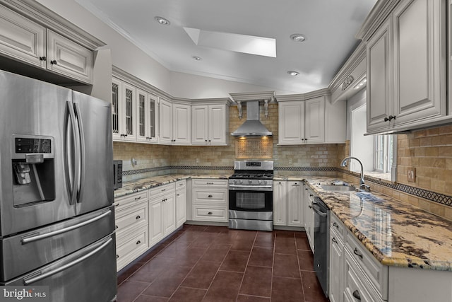 kitchen with wall chimney exhaust hood, stainless steel appliances, white cabinets, and stone counters