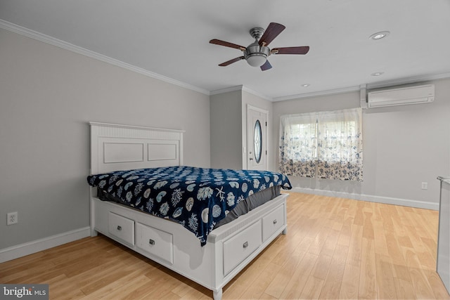 bedroom featuring light hardwood / wood-style flooring, ceiling fan, crown molding, and a wall mounted air conditioner